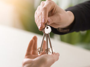 handing over keys to someone